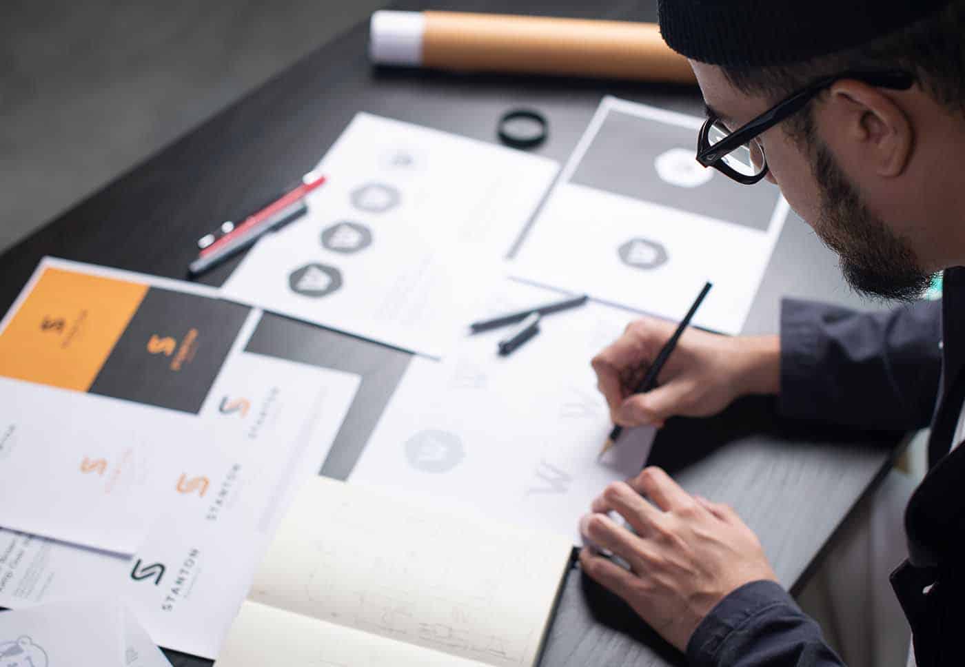 creative and design team making a brand guideline with brand colors, logos, and more.