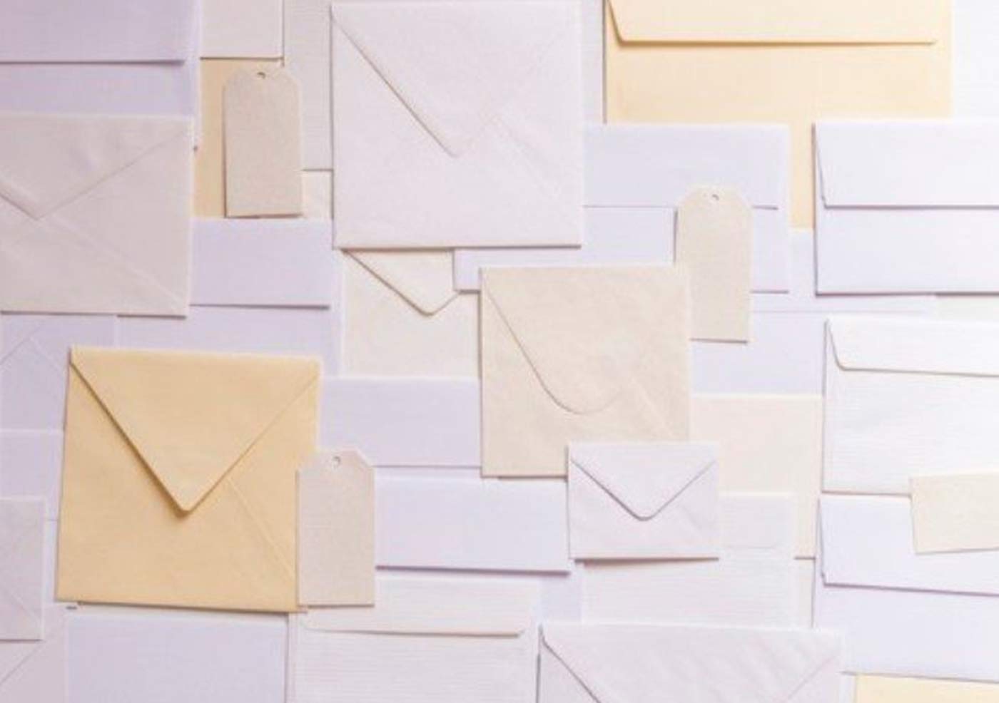 a collage of layered envelopes