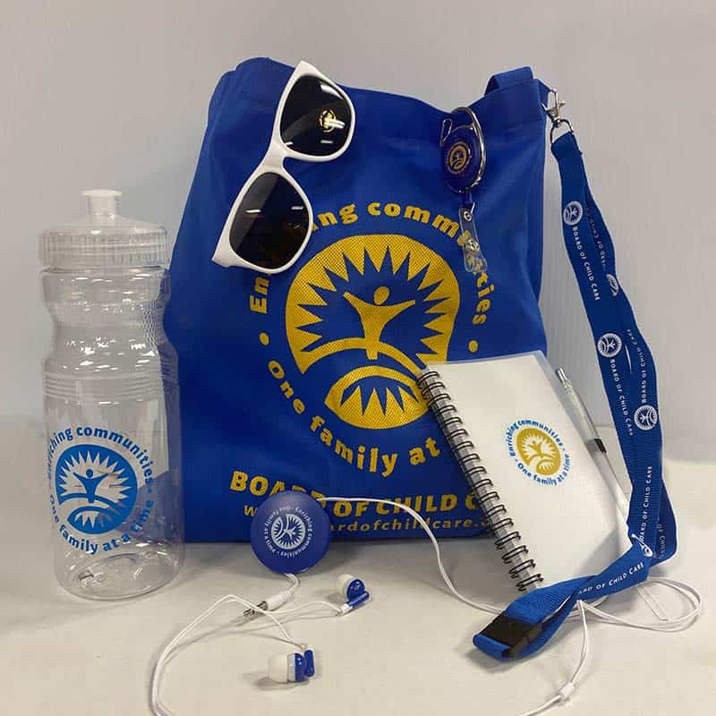 nonprofit branded bag, sunglasses, water bottle, and journal promotional products