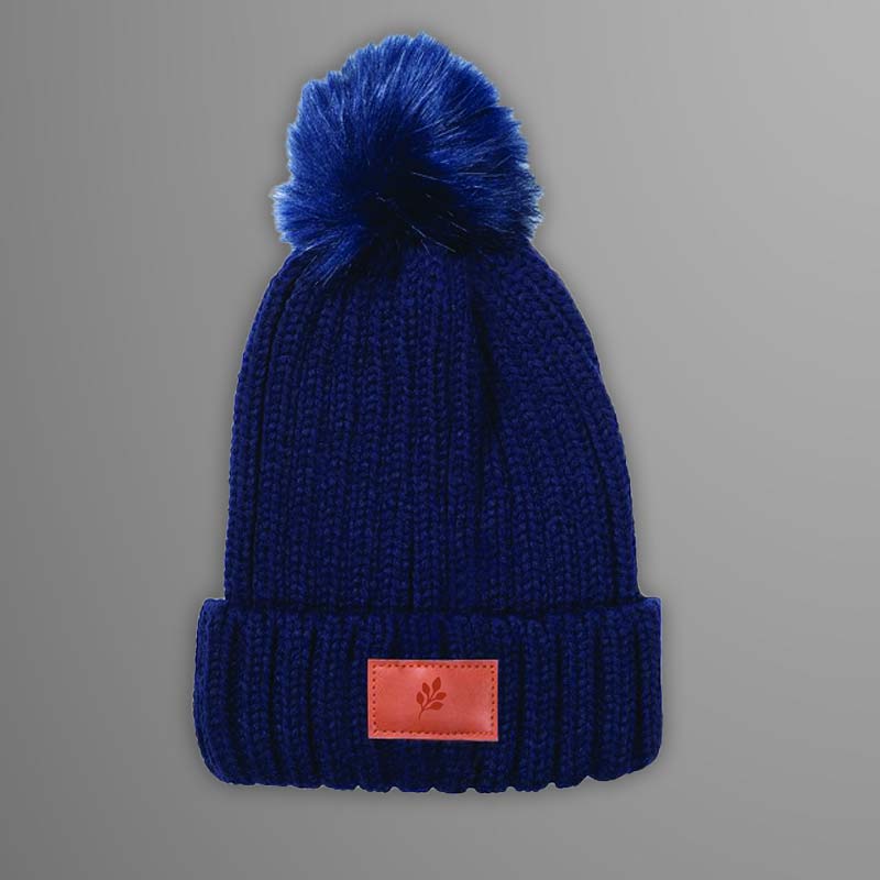 blue knit hat with pom