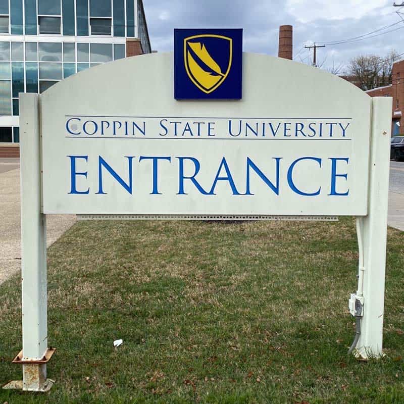 Replacement trim cap squares made for a Coppin State University entrance sign with posts fixed in the ground
