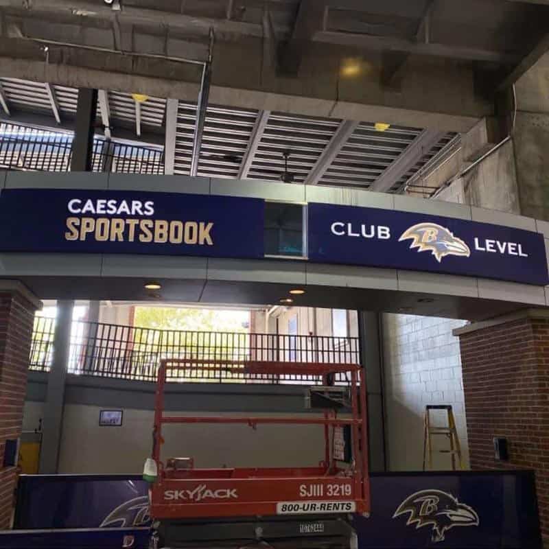 Baltimore Ravens club-level stadium signage with Caesars Sportsbook branding