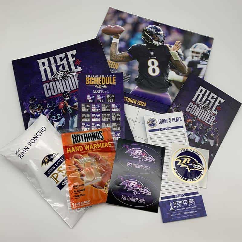 Contents of the Baltimore Ravens PSL Kit with sports team memorabilia and gifts for Permanent Seat License ticket holders