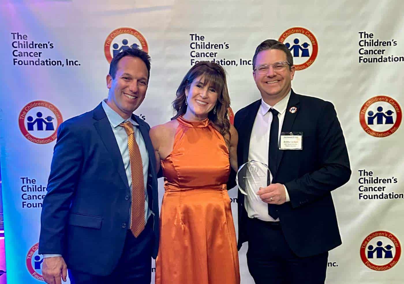 Tasha Museles, director of Children’s Cancer Foundation, honors Strategic Factory team Scott Stein and Bobby Cardoni with the 2025 Children's Cancer Foundation Fighter Award at the 41st Annual CCF Gala on November 1st 2025